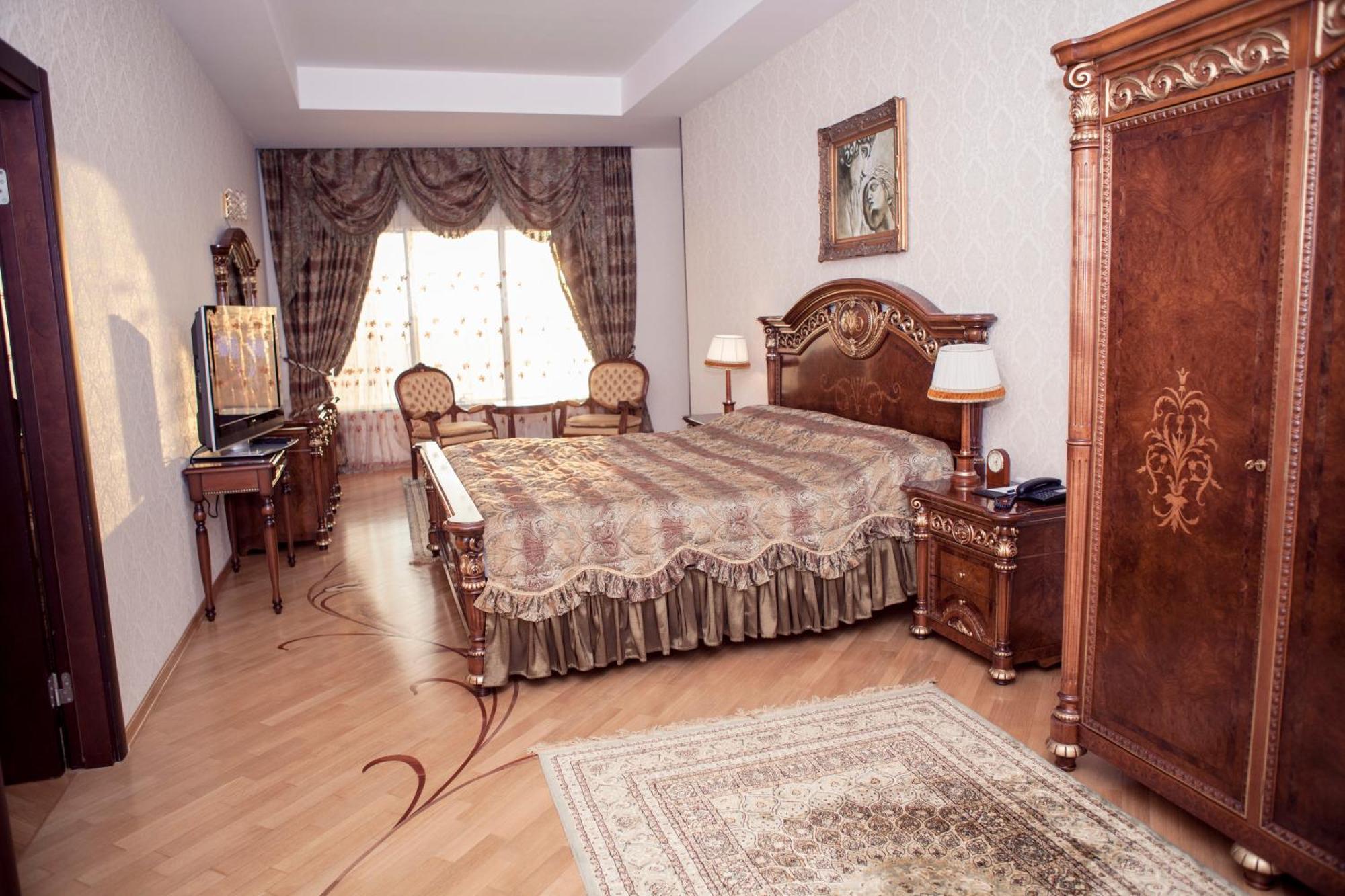 אקטאו Grand Hotel Victory מראה חיצוני תמונה A bedroom